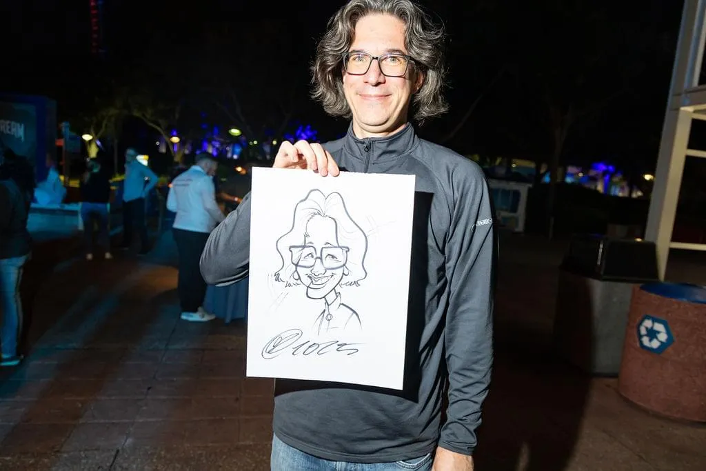 Tamas Varga with his caricature portrait at Sitecore MVP Summit 2025 in Orlando, Florida